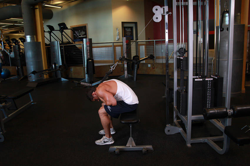 Cable Seated Crunch — end position