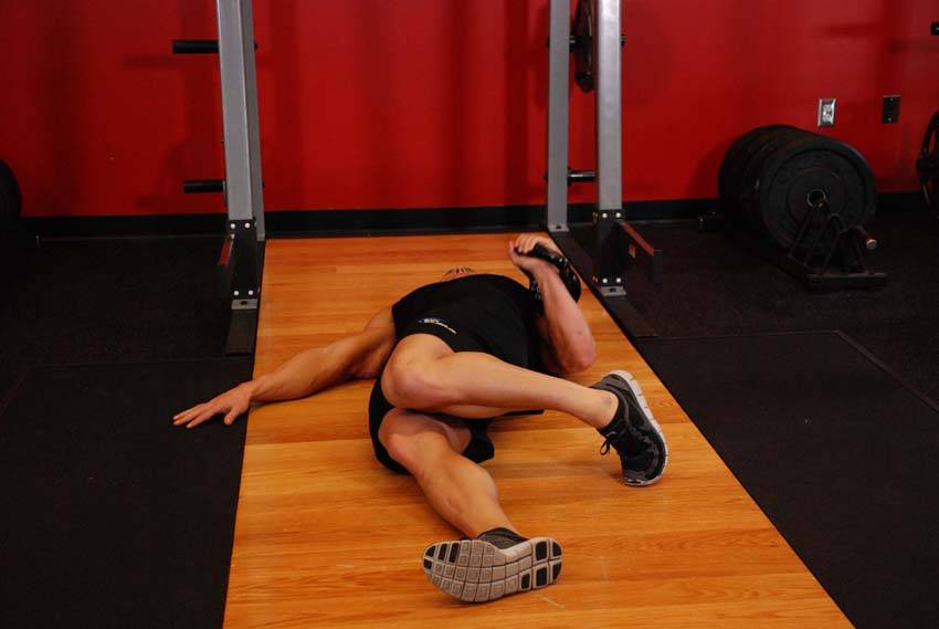 Extended Range One-Arm Kettlebell Floor Press — starting position