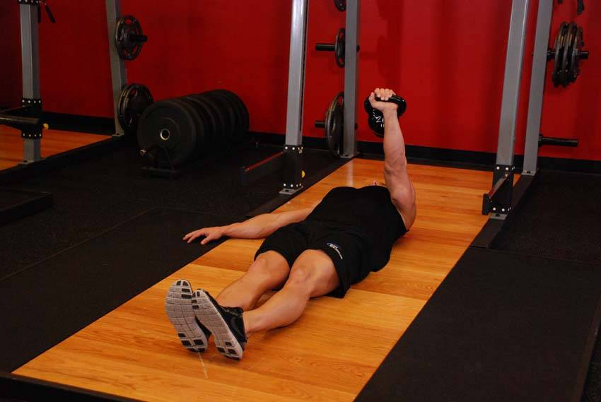 One-Arm Kettlebell Floor Press — end position