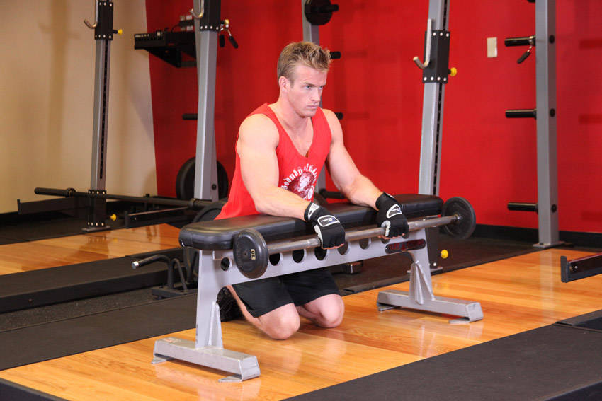Palms-Down Wrist Curl Over A Bench — starting position