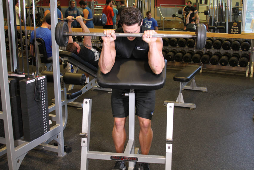 Reverse Barbell Preacher Curls — end position