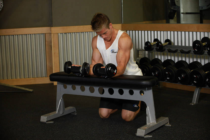 Palms-Up Dumbbell Wrist Curl Over A Bench — end